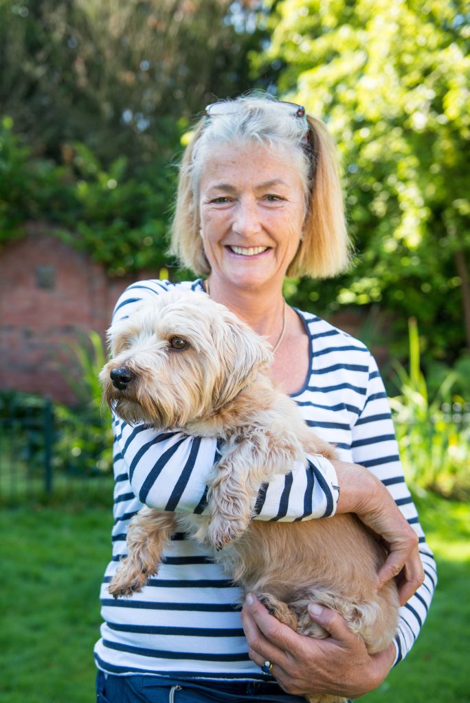 Lady holding a dog